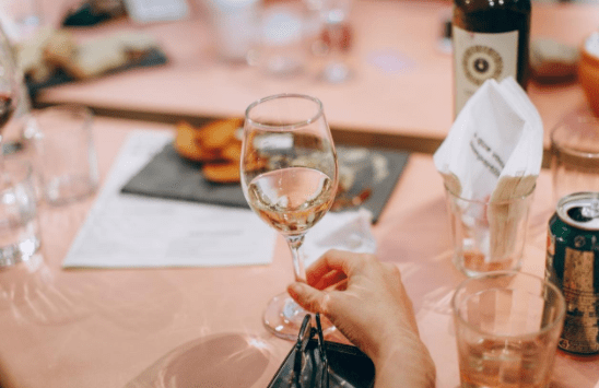 Woman holding a wine glass at a wedding